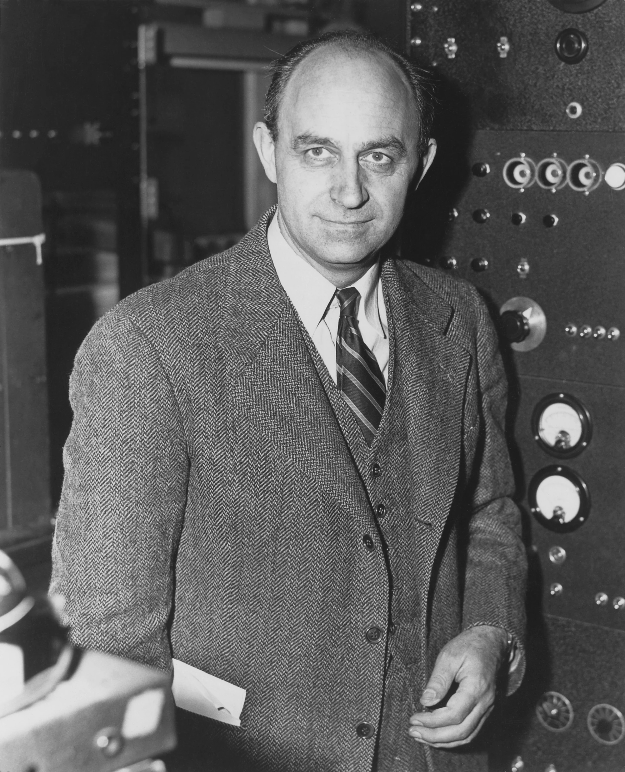 Enrico Fermi standing beside laboratory equipment, circa 1943–1949.